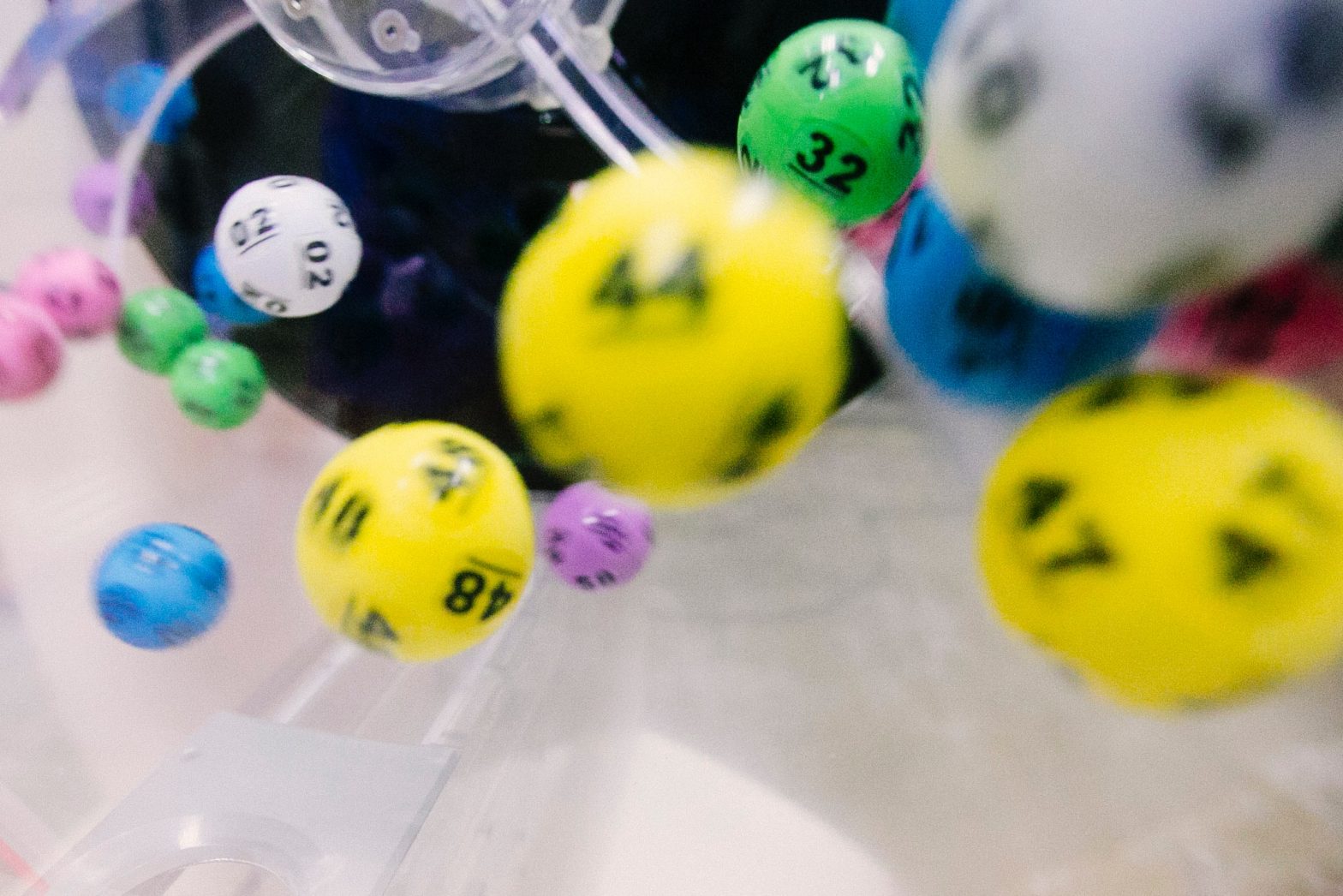 Photo of lottery balls in the barrel as it spins