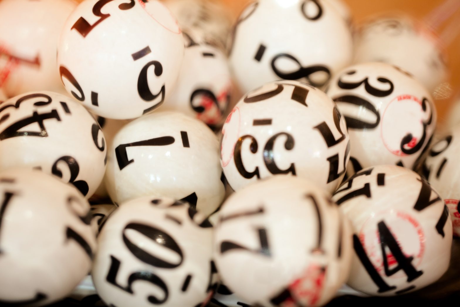 Photo of lottery balls showing some of the numbers that are in the lottery