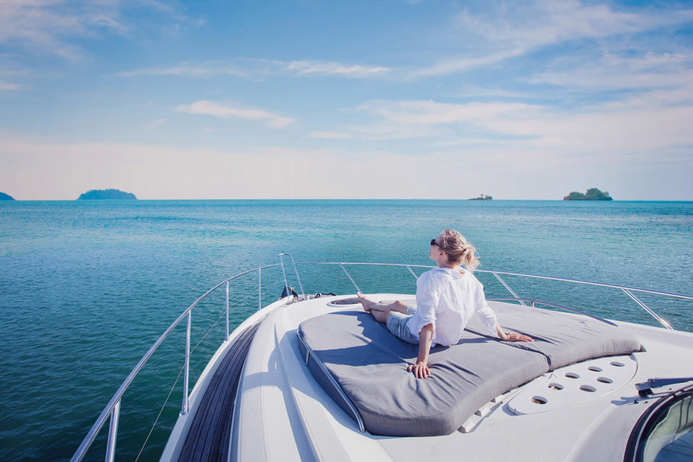 Lottery winners - woman on luxury yacht.